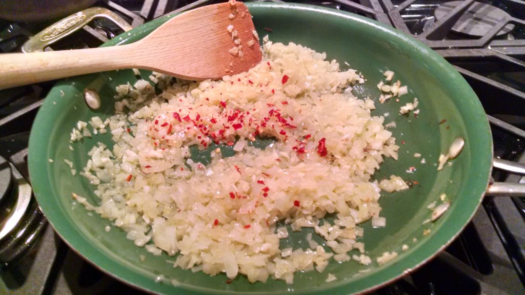 Saute the onions until just translucent and add the minced garlic, chili flakes and parsley to soften.