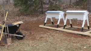 Here are the new hives on on a platform made by 2 X 4's with a gravel base.  Wild flowers will be planted in the background for Spring.